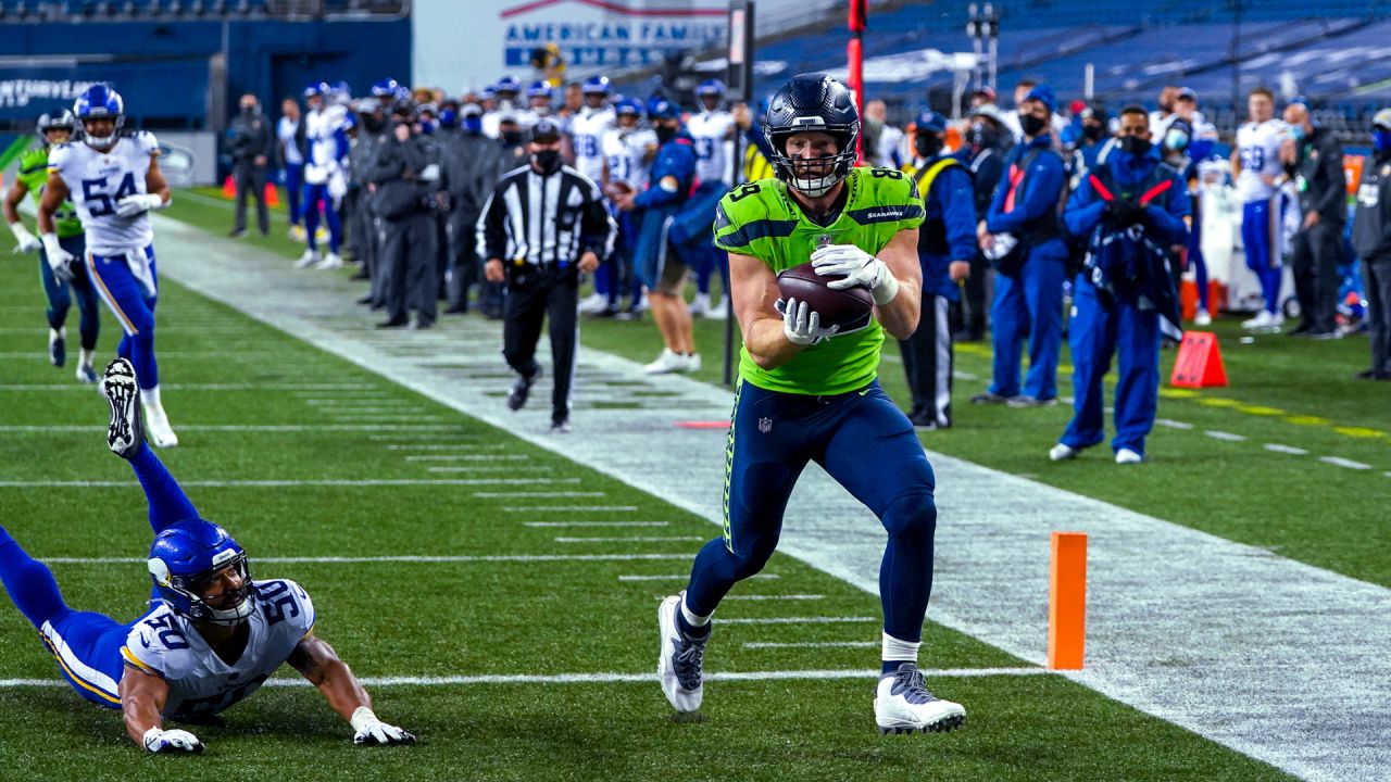 Seattle Seahawks wide receiver DK Metcalf, right, greets quarterback  Russell Wilson during warmups before an NFL football game against the Tennessee  Titans, Sunday Sept. 19, 2021, in Seattle. The Titans won 33-30