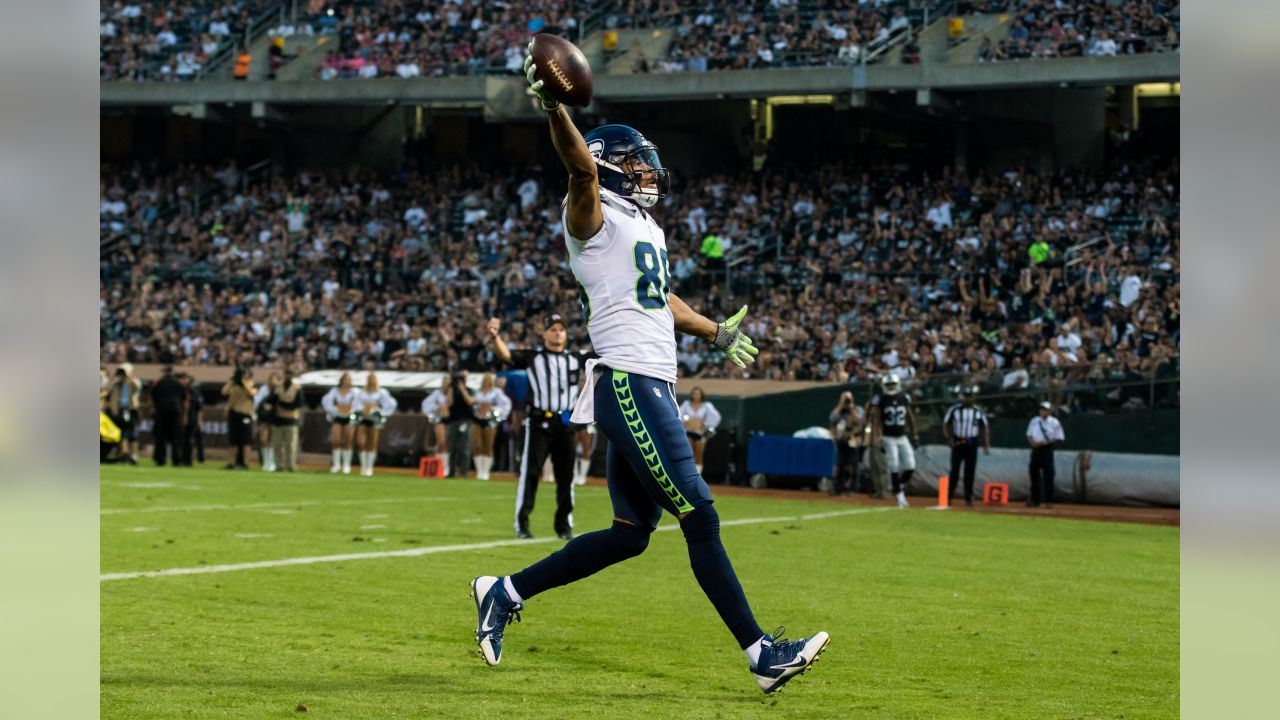 Oakland Raiders' head coach Dennis Allen looks at the replay screen in  their game against the Seattle Seahawks at CenturyLink Field in Seattle,  Washington on August 30, 2012. The Seahawks beat the