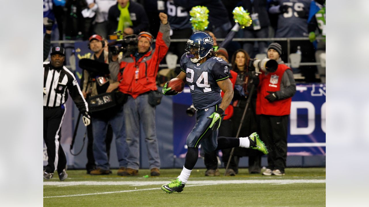 A stunned New Orleans Saints' Roman Harper walks off the field as the  Seattle Seahawks' celebrate their 41-36 win over the Super Bowl Defending  Champions in the NFC's wild-card playoff game on