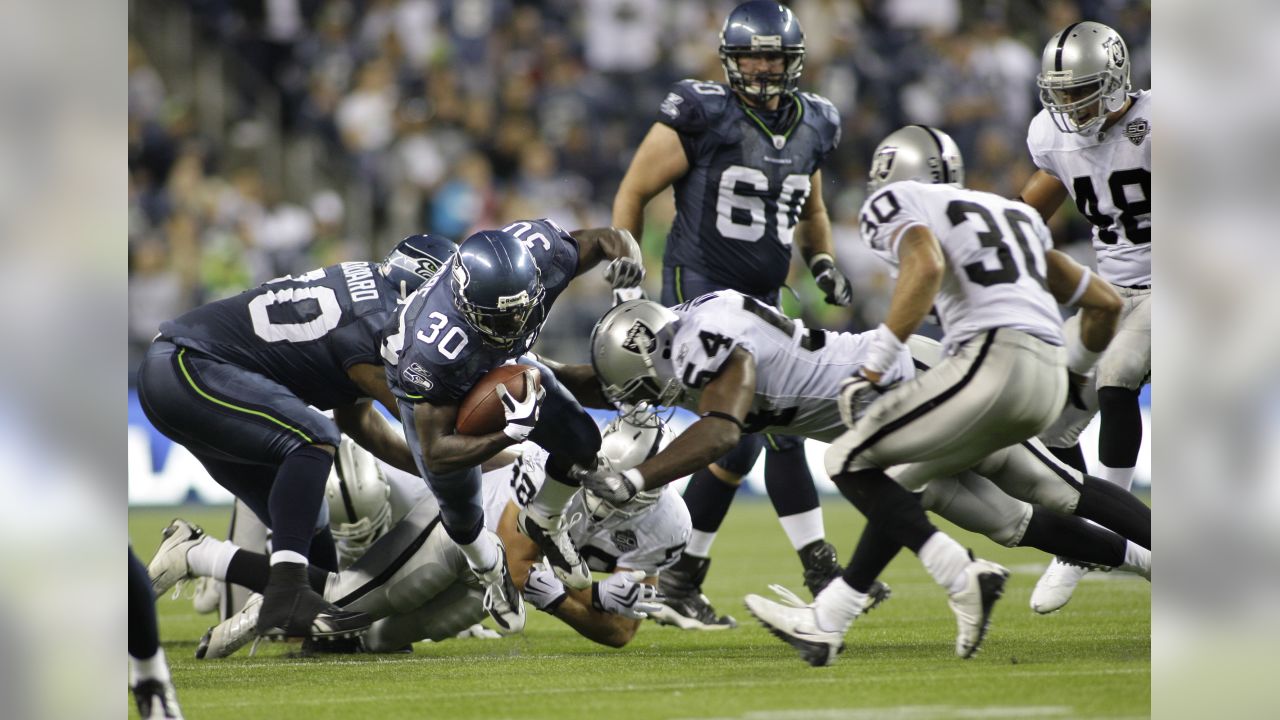 RAIDERS, Oakland Raiders Napoleon Kaufman dodges a tackle a…