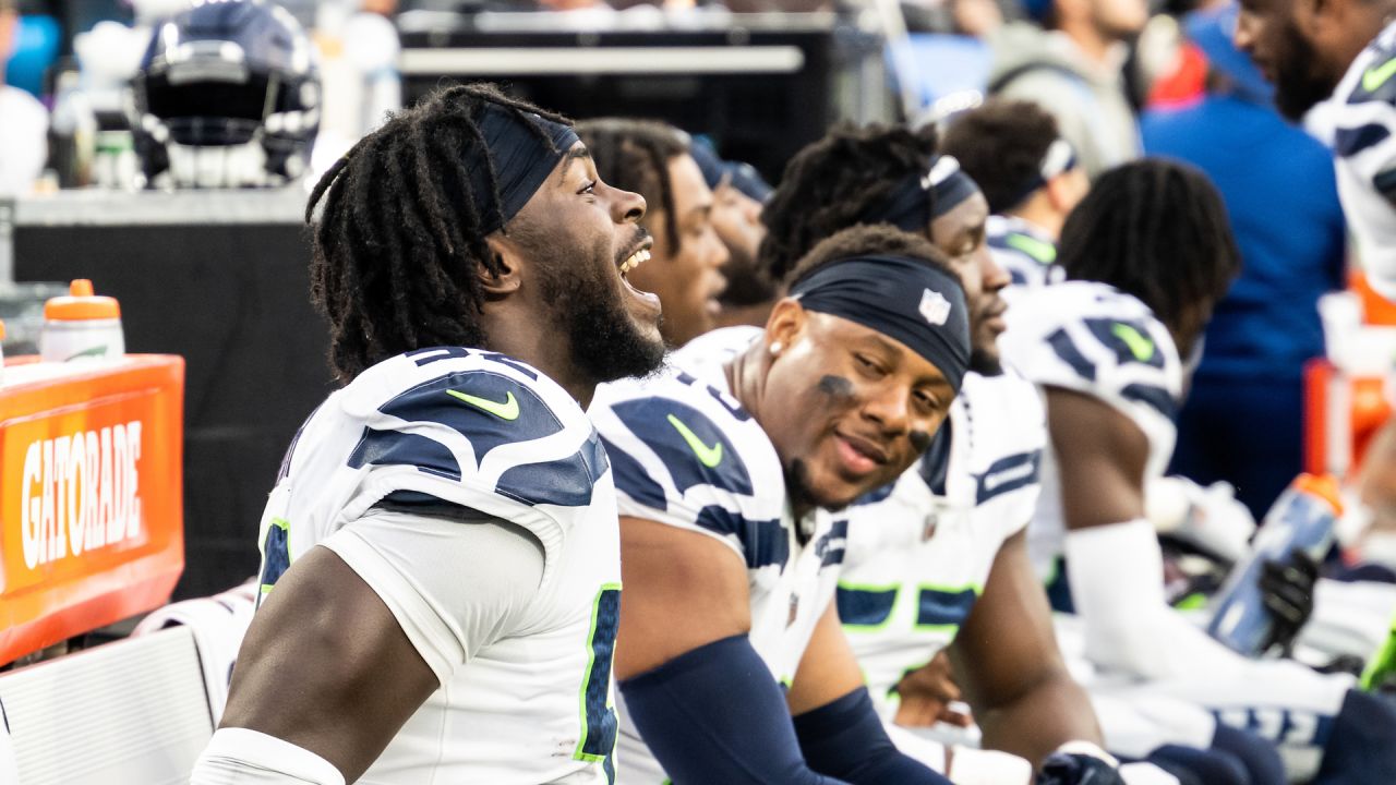 Seahawks LB Darrell Taylor runs onto the field after an interception,  giving Seattle a real 12th man 