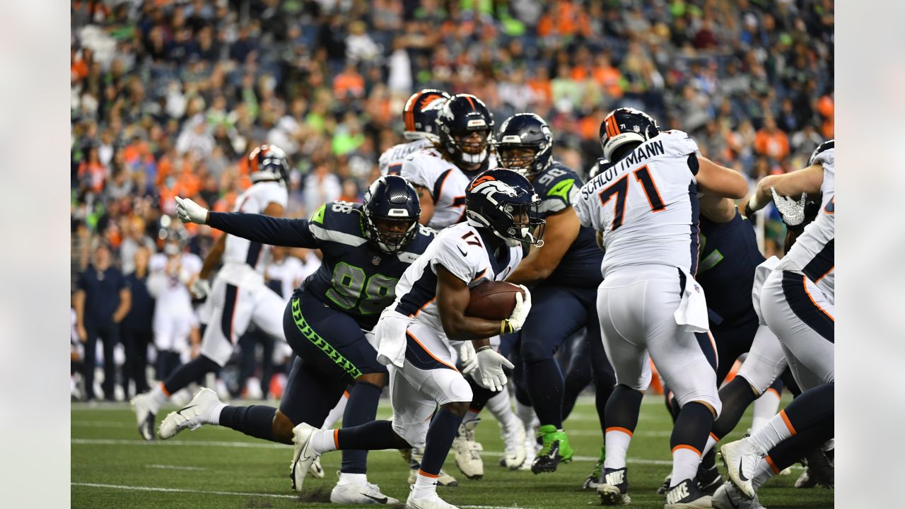 Denver Broncos running back Javonte Williams (33) during an NFL football  game against the Seattle Seahawks, Monday, Sept. 12, 2022, in Seattle, WA.  The Seahawks defeated the Bears 17-16. (AP Photo/Ben VanHouten