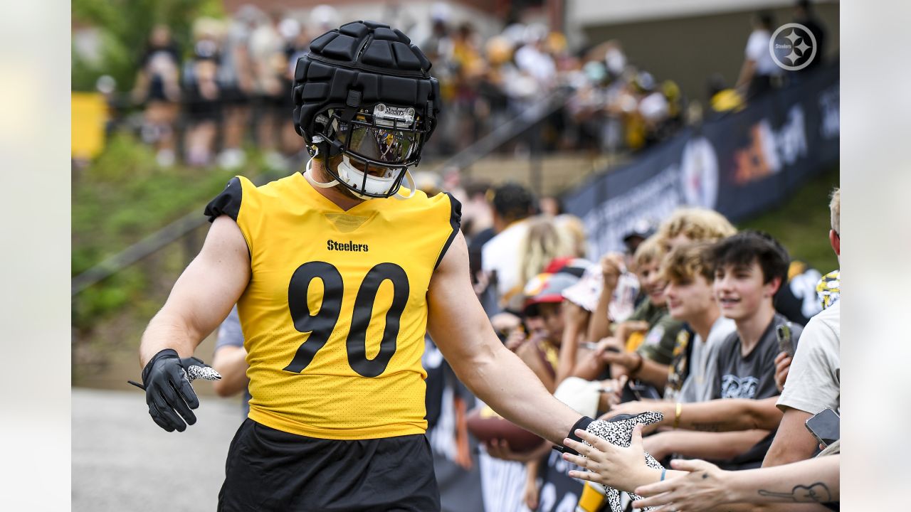 Check out Steelers LB T.J. Watt as he signs a baby at training camp