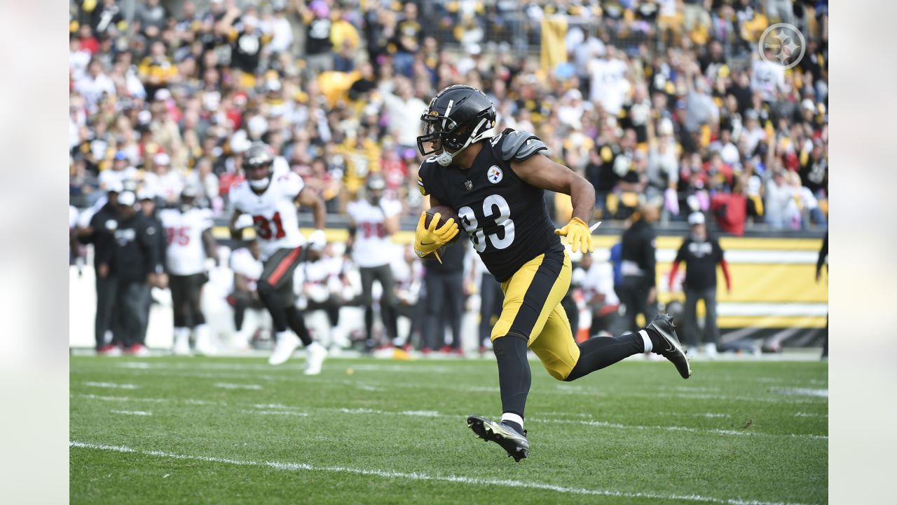 Pittsburgh Steelers defensive tackle Cameron Heyward (97) laughs as he  talks with Tampa Bay Buccaneers quarterback Tom Brady (12) after a play  during an NFL football game, Sunday, Oct. 16, 2022, in