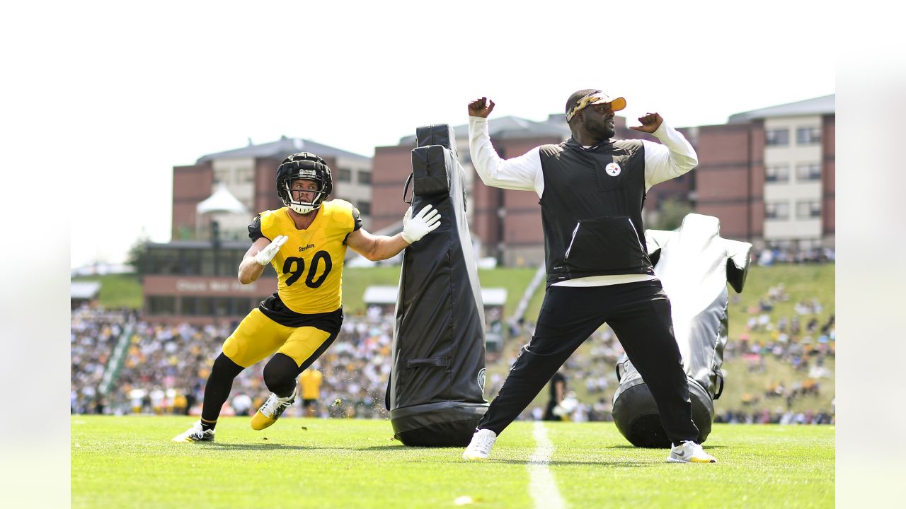 Check out Steelers LB T.J. Watt as he signs a baby at training camp