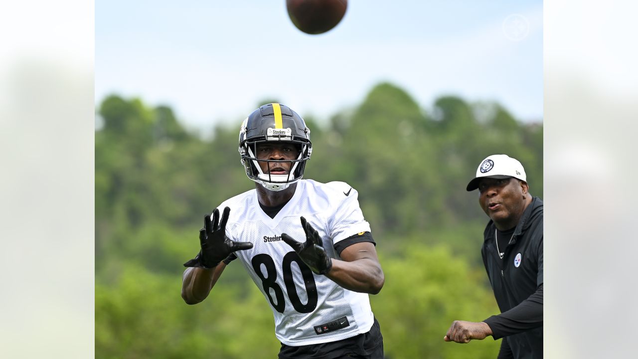 Tanner Morgan of the Pittsburgh Steelers hands off during a