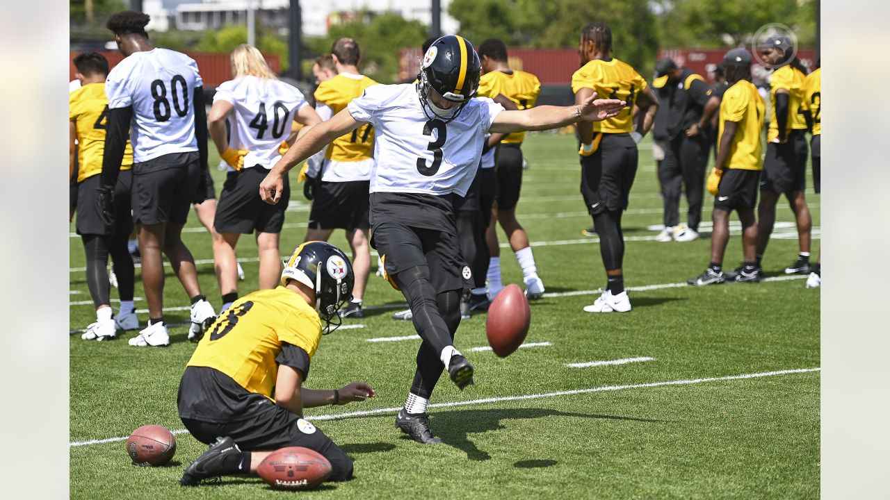 Tanner Morgan of the Pittsburgh Steelers hands off during a