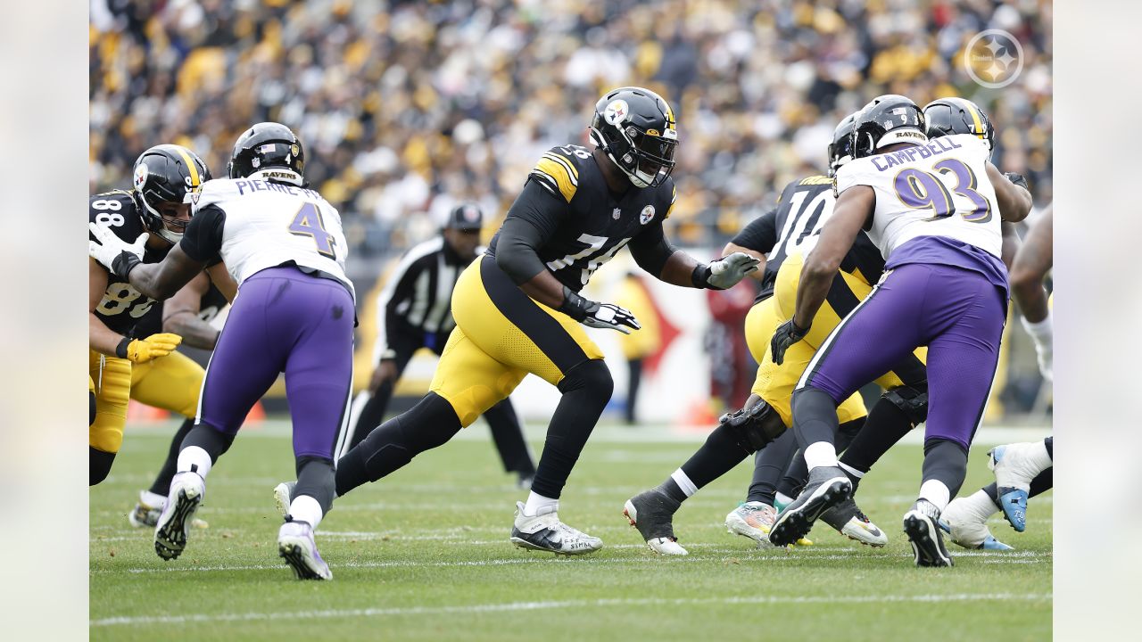 PITTSBURGH, PA - DECEMBER 11: Baltimore Ravens running back J.K. Dobbins (27)  is tackled by Pittsburgh Steelers safety Minkah Fitzpatrick (39),  Pittsburgh Steelers defensive tackle Larry Ogunjobi (99), and Pittsburgh  Steelers defensive