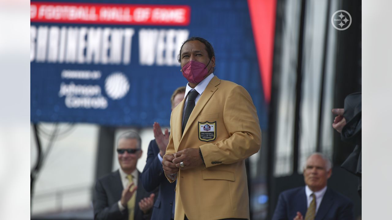 Canton, United States. 07th Aug, 2021. Class of 2020 inductee, Troy Polamalu  receives his gold jacket from NFL Commisioner Roger Goodell (L) during his  enshrinement into the Pro Football Hall of Fame