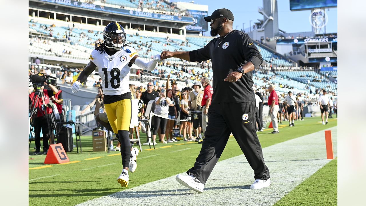 Pittsburgh Steelers head coach Mike Tomlin, center, calls out instructions  from the sideline during the second half of a preseason NFL football game  against the Jacksonville Jaguars, Saturday, Aug. 20, 2022, in