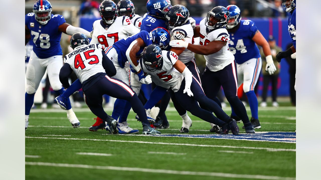 New York Giants linebacker Tomon Fox (49) walks off the field after an NFL  football game against the Houston Texans on Sunday, Nov. 13, 2022, in East  Rutherford, N.J. (AP Photo/Adam Hunger