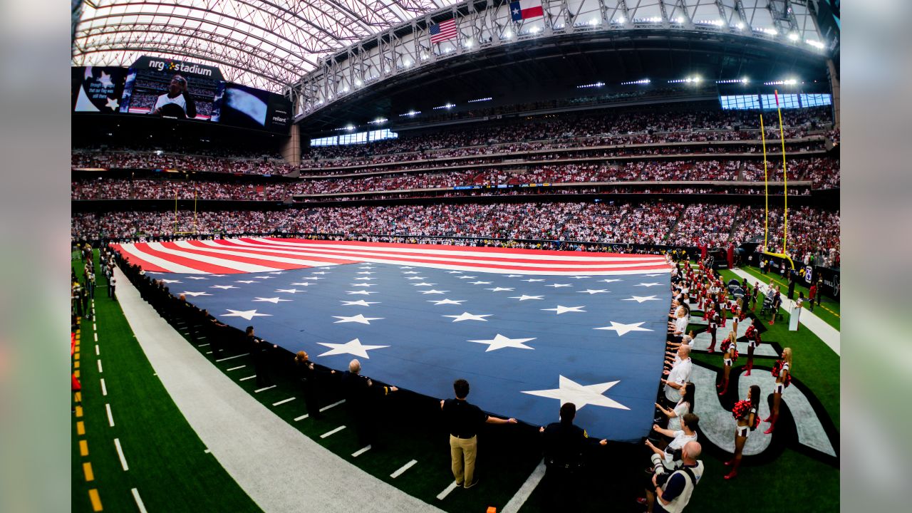 January 4, 2020: Houston Texans fans wave flags during the 1st quarter of  an NFL football playoff game between the Buffalo Bills and the Houston  Texans at NRG Stadium in Houston, TX.