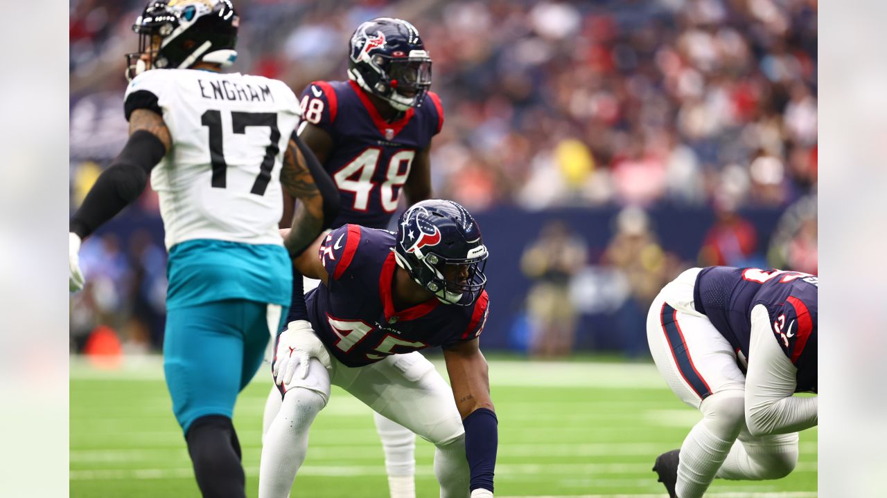 Houston, Texas, USA. 1st Jan, 2023. Jacksonville Jaguars running back  JaMycal Hasty (22) carries the ball while being tackled by Houston Texans  linebacker Christian Harris (48) during the game between the Houston