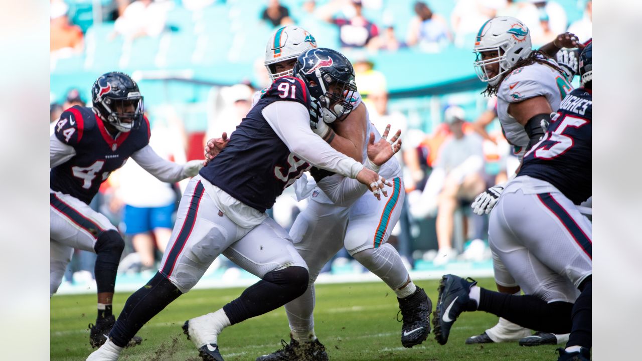 Houston Texans defensive tackle Thomas Booker IV (56) in between plays  during the first half of an NFL football game against the Las Vegas  Raiders, Sunday, Oct 23, 2022, in Las Vegas. (