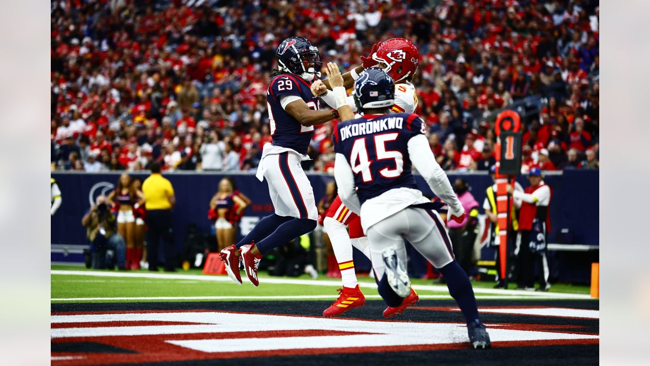 Kansas City Chiefs PATRICK MAHOMES (10) takes a hard hit from CHRISTIAN  HARRIS (48) during the game between the Kansas City Chiefs and the Houston  Texans in Houston, Texas at NRG Stadium