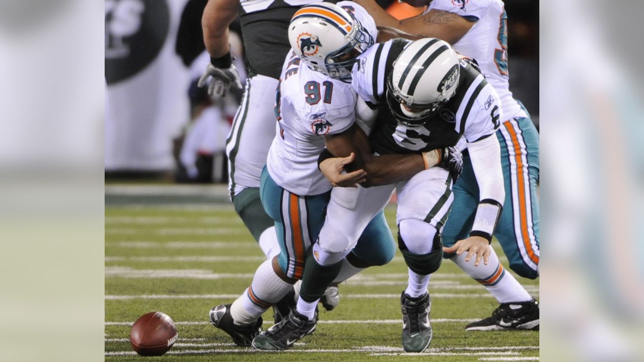 Miami Dolphins line backer Jason Taylor has some words for a referee during  the first quarter against the New York Jets of an NFL football game,  Monday, October 12, 2009, at Land