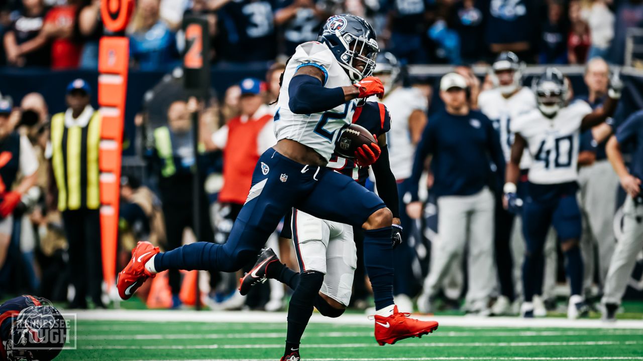 HOUSTON, TX - OCTOBER 30: Football fans hold up a Houston Oilers team flag  during the NFL game between the Tennessee Titans and Houston Texans on  October 30, 2022 at NRG Stadium