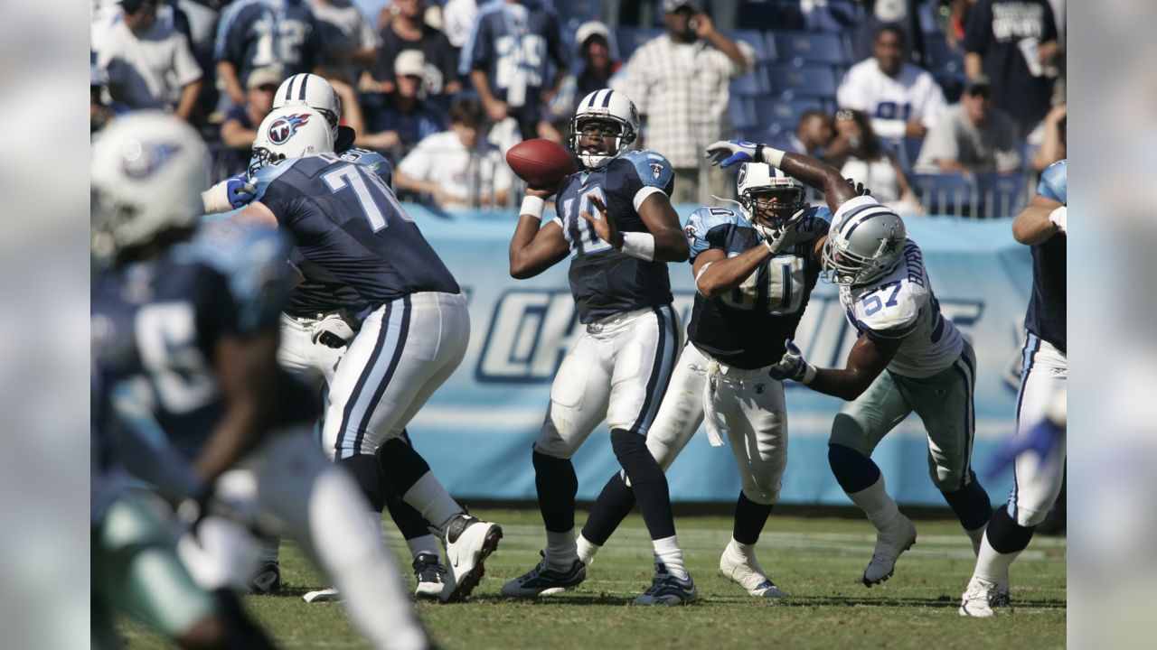 Dallas Cowboys receiver Terrell Owens (81) watches the action against the  Philadelphia Eagles from the sidelines in the fourth quarter. Teammate  Anthony Henry sits to the right. The Eagles defeated the Cowboys