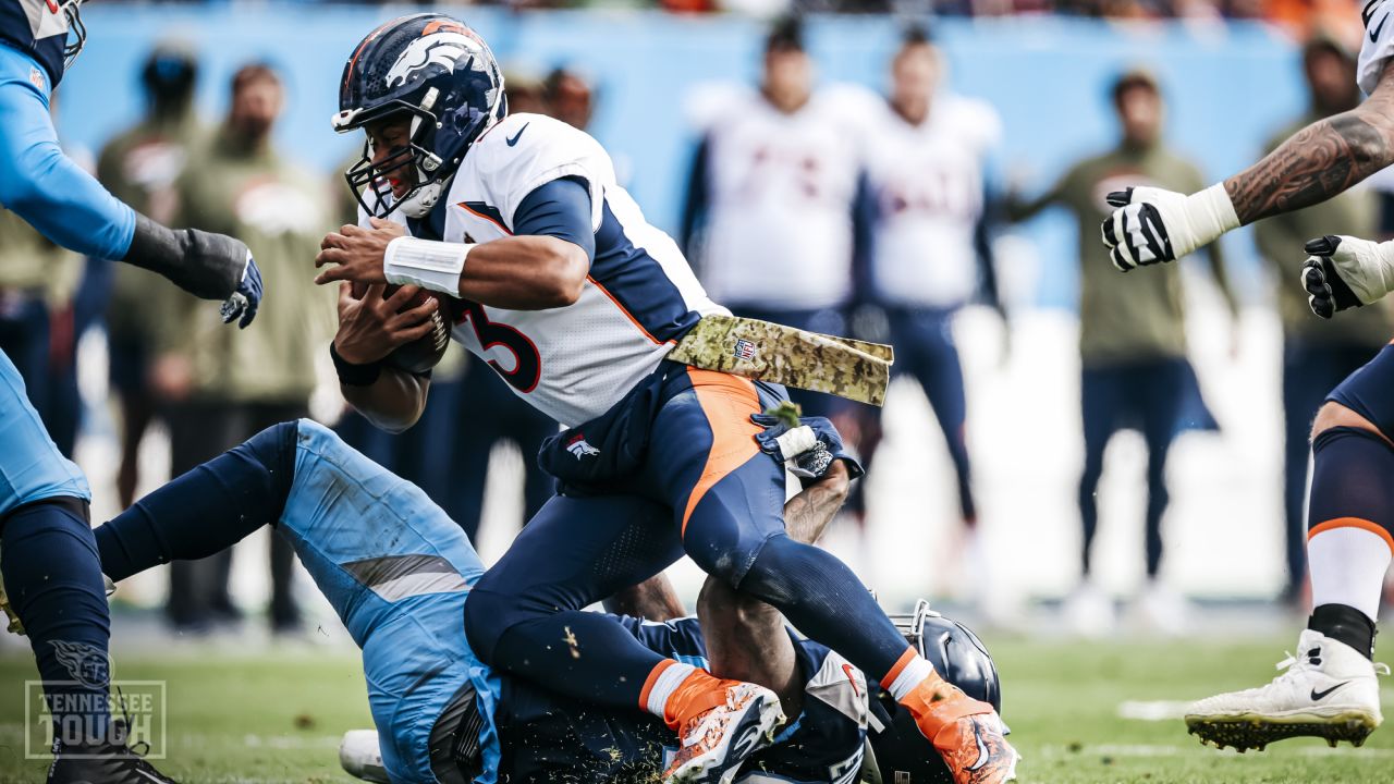 NASHVILLE, TN - NOVEMBER 27: Tennessee Titans defensive end DeMarcus Walker  (95) celebrates a tackle during a game between the Tennessee Titans and  Cincinnati Bengals, November 27, 2022 at Nissan Stadium in