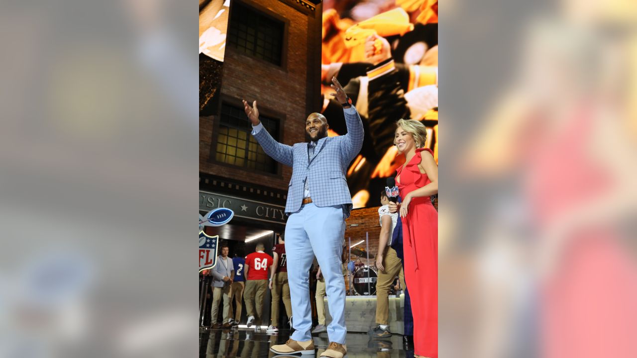 Tennessee Titans player Jurrell Casey enters the main stage to announce the  Titans selection of North Carolina-Charlotte guard Nate Davis during the  third round of the NFL football draft, Friday, April 26