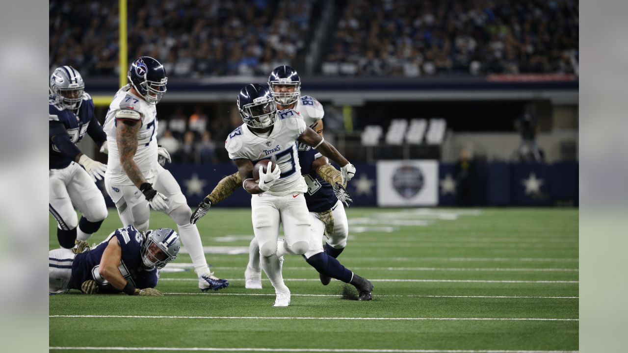 November 05, 2018:.Tennessee Titans quarterback Marcus Mariota (8)  scrambles for a first down during an NFL football game between the Tennessee  Titans and Dallas Cowboys at AT&T Stadium in Arlington, Texas. Manny