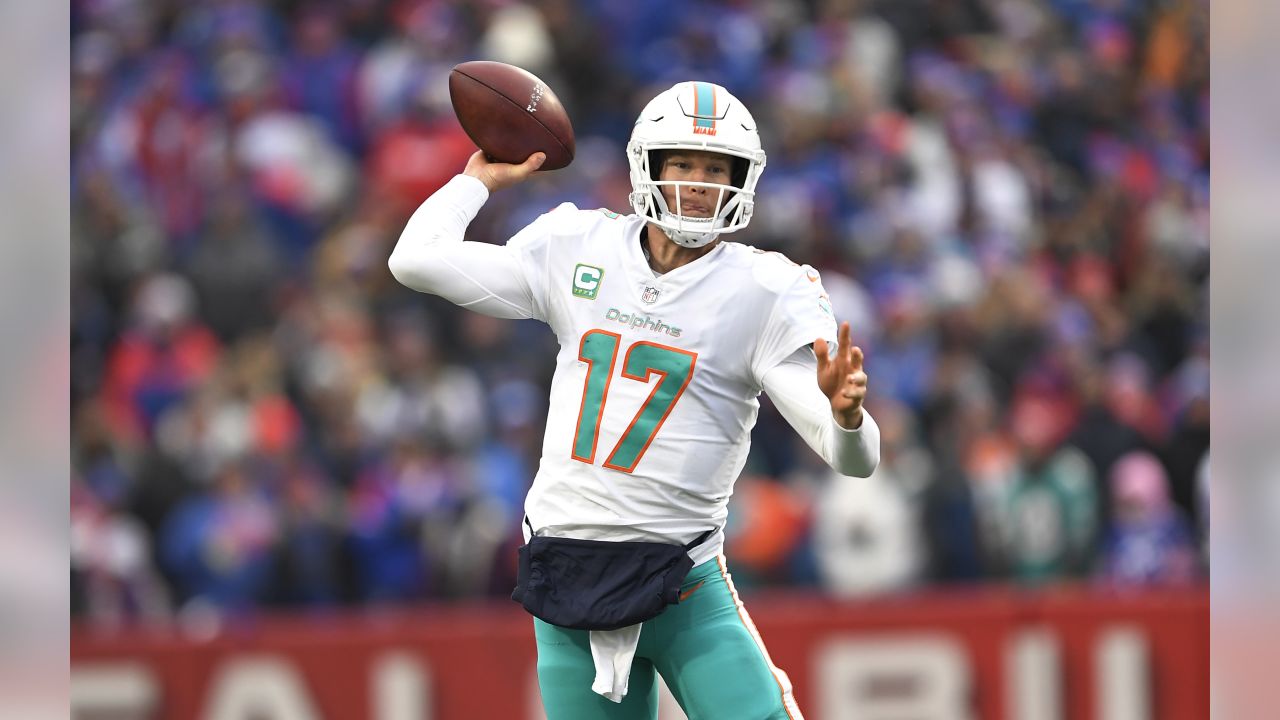 FILE - In this Oct. 14, 2018, file photo, injured Miami Dolphins  quarterback Ryan Tannehill cheers his team during the second half of an NFL  football game against the Chicago Bears, in