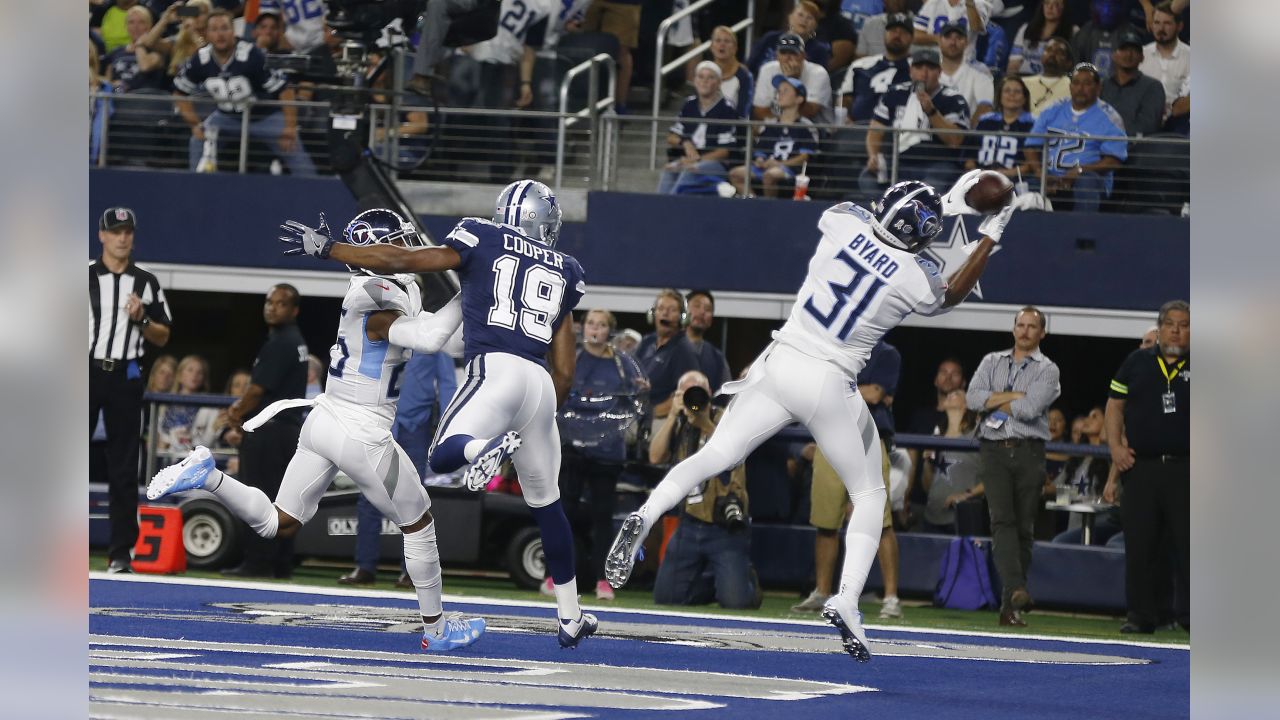 November 05, 2018:.Tennessee Titans quarterback Marcus Mariota (8)  scrambles for a first down during an NFL football game between the  Tennessee Titans and Dallas Cowboys at AT&T Stadium in Arlington, Texas.  Manny