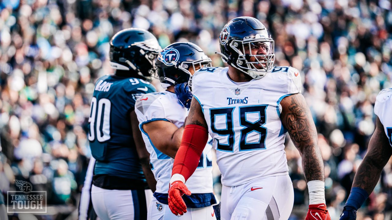 Tennessee Titans defensive tackle Jeffery Simmons (98) and linebacker  Rashad Weaver (99) talk before play starts