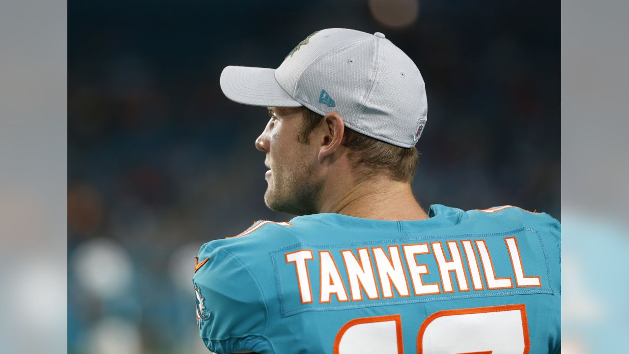 Miami Dolphins quarterback Ryan Tannehill runs a quarterback keeper for a  first down