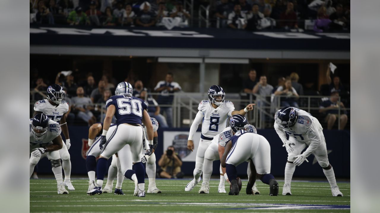 November 05, 2018:.Tennessee Titans quarterback Marcus Mariota (8)  scrambles for a first down during an NFL football game between the  Tennessee Titans and Dallas Cowboys at AT&T Stadium in Arlington, Texas.  Manny