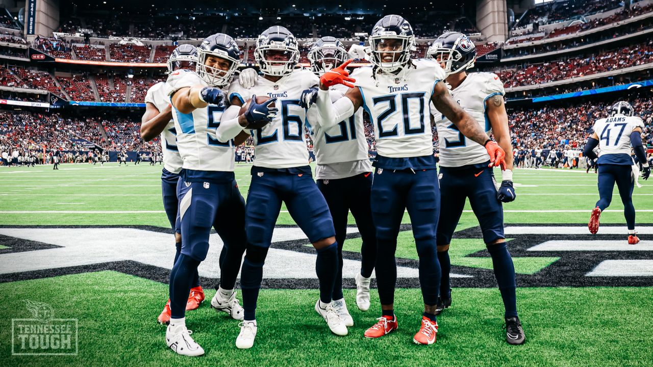 HOUSTON, TX - OCTOBER 30: Football fans hold up a Houston Oilers team flag  during the NFL game between the Tennessee Titans and Houston Texans on  October 30, 2022 at NRG Stadium