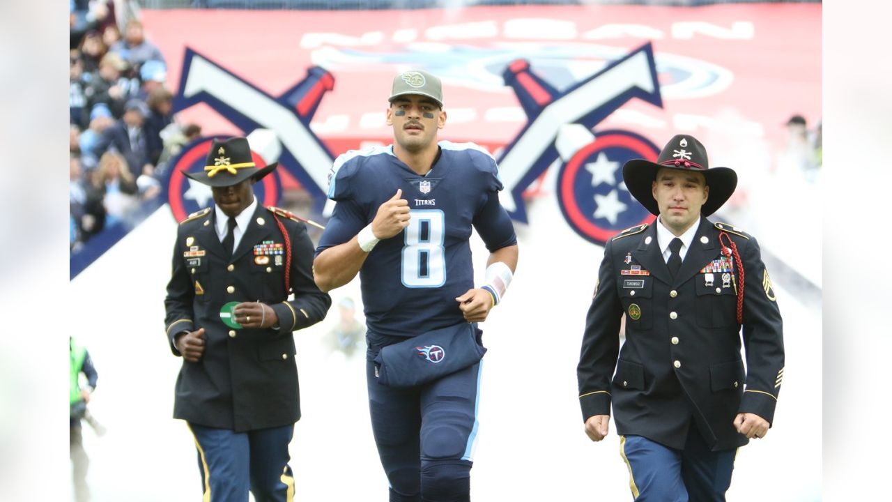 Tennessee Titans tackle Taylor Lewan (77) shakes hands with military  veterans during halftime at NFL football game between the Titans and the  Cincinnati Bengals Sunday, Nov. 12, 2017, in Nashville, Tenn. (AP