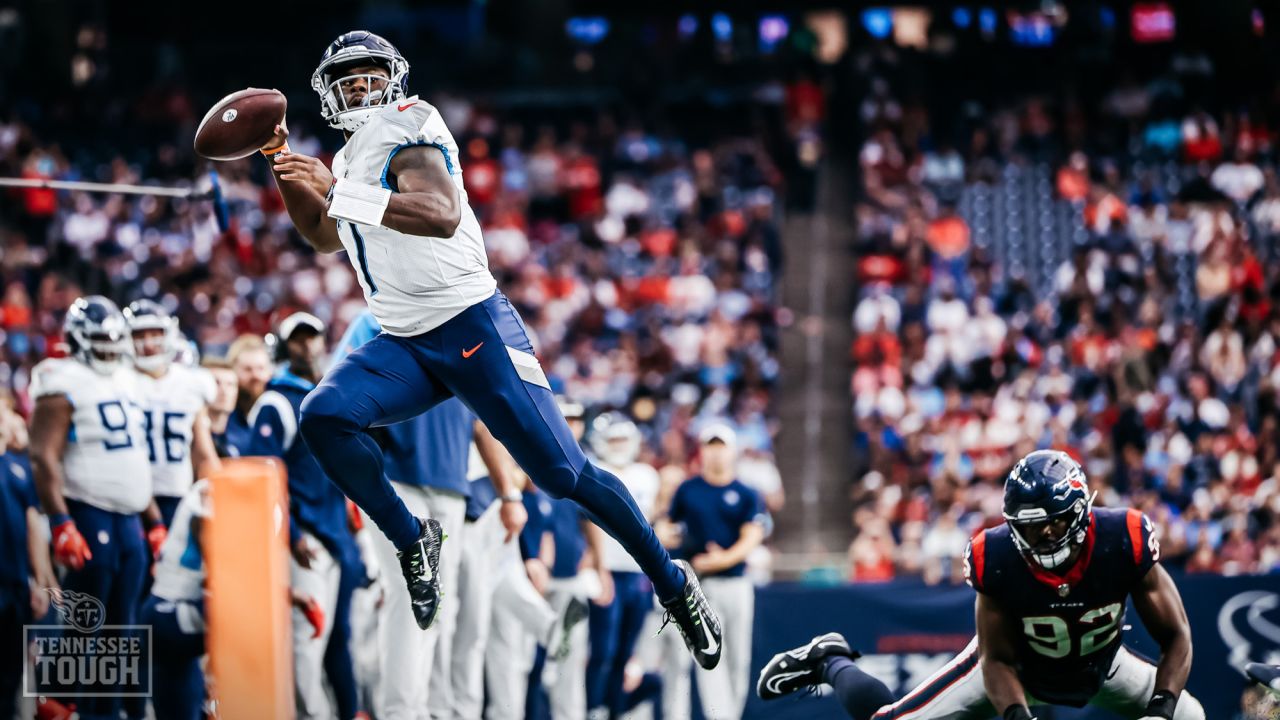 HOUSTON, TX - OCTOBER 30: Football fans hold up a Houston Oilers team flag  during the NFL game between the Tennessee Titans and Houston Texans on  October 30, 2022 at NRG Stadium