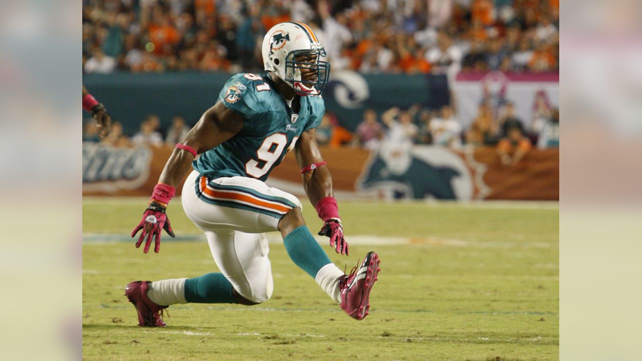 Randy Starks of the Miami Dolphins sacks Tom Brady of the New England  Patriots in the second quarter on Monday, September 12, 2011, at Sun Life  Stadium in Miami Gardens, Florida. (Photo