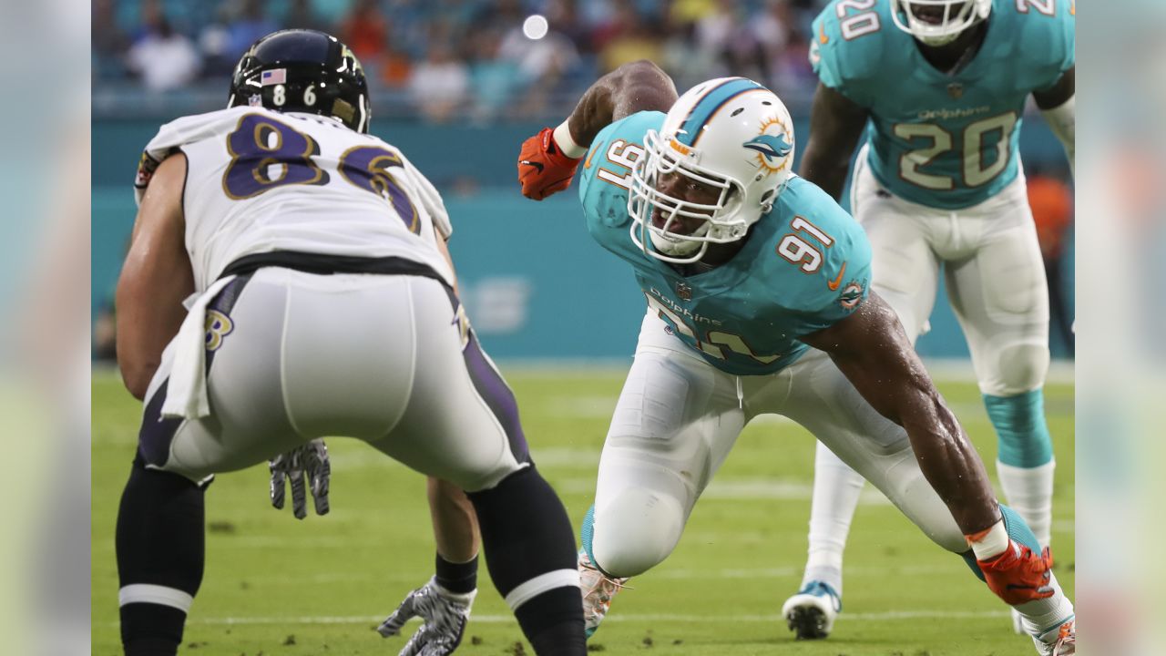 Miami Dolphins linebacker Raekwon McMillan (52) walks the sidelines, during  the second half of an NFL preseason football game against the Tampa Bay  Buccaneers, Thursday, Aug. 9, 2018, in Miami Gardens, Fla. (