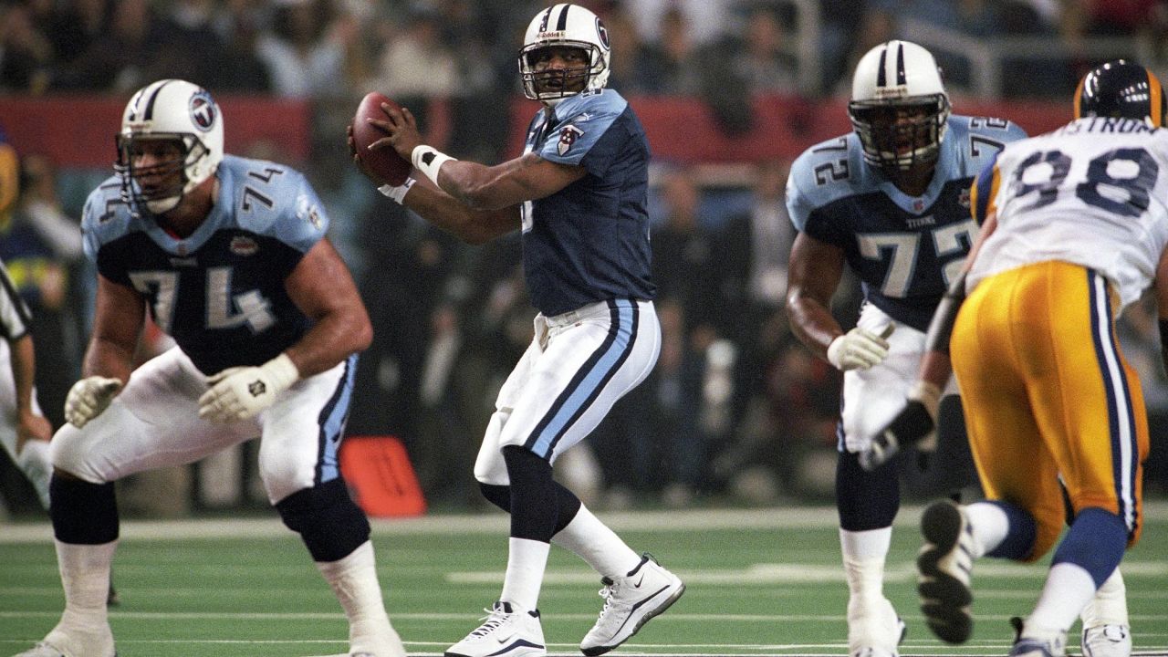 JANUARY 30 2000: Titans quarterback Steve McNair scrambles with the  football as the St. Louis Rams defeated the Tennessee Titans 23-17 to win  Super Bowl XXXIV at the Georgia Dome in Atlanta