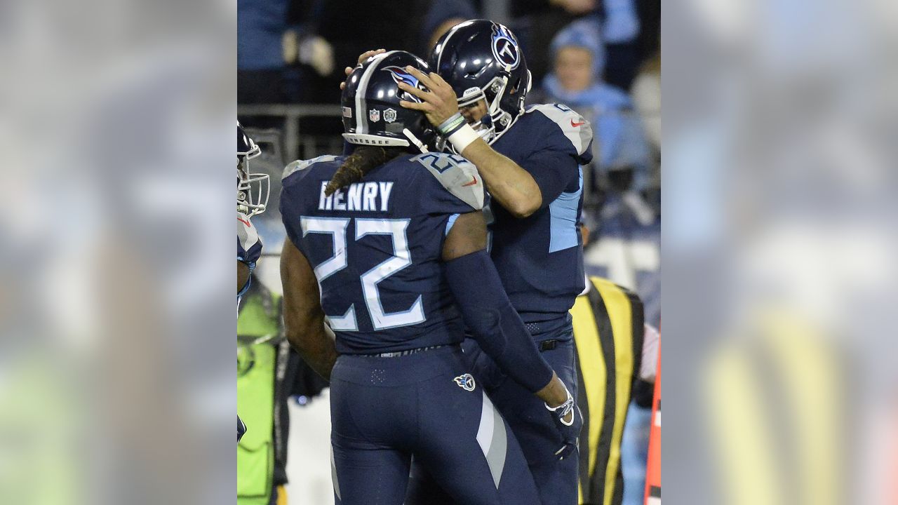 Tennessee Titans running back Derrick Henry (22) celebrates his touchdown  with Tennessee Titans quarterback Marcus Mariota (8) during the second half  of an NFL football game against the Jacksonvil …