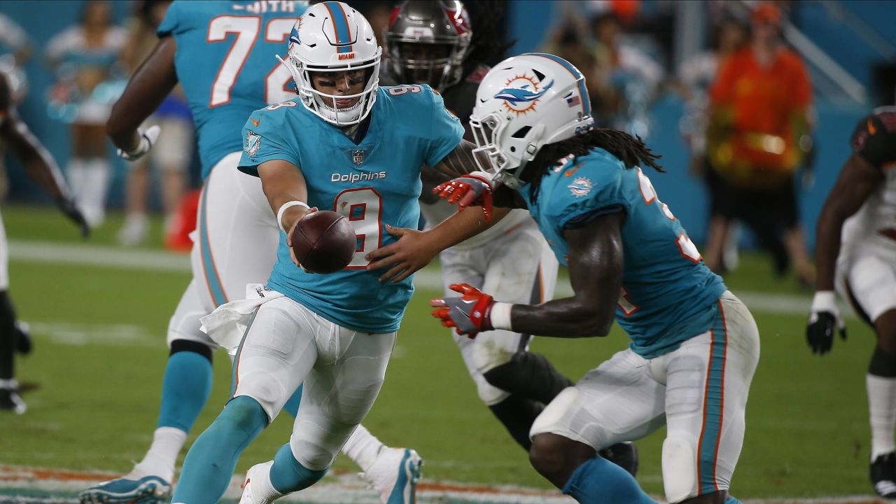 Miami Dolphins running back Senorise Perry (34) walks back to the bench  after scoring a touchdown, during the first half of an NFL preseason  football game against the Tampa Bay Buccaneers, Thursday