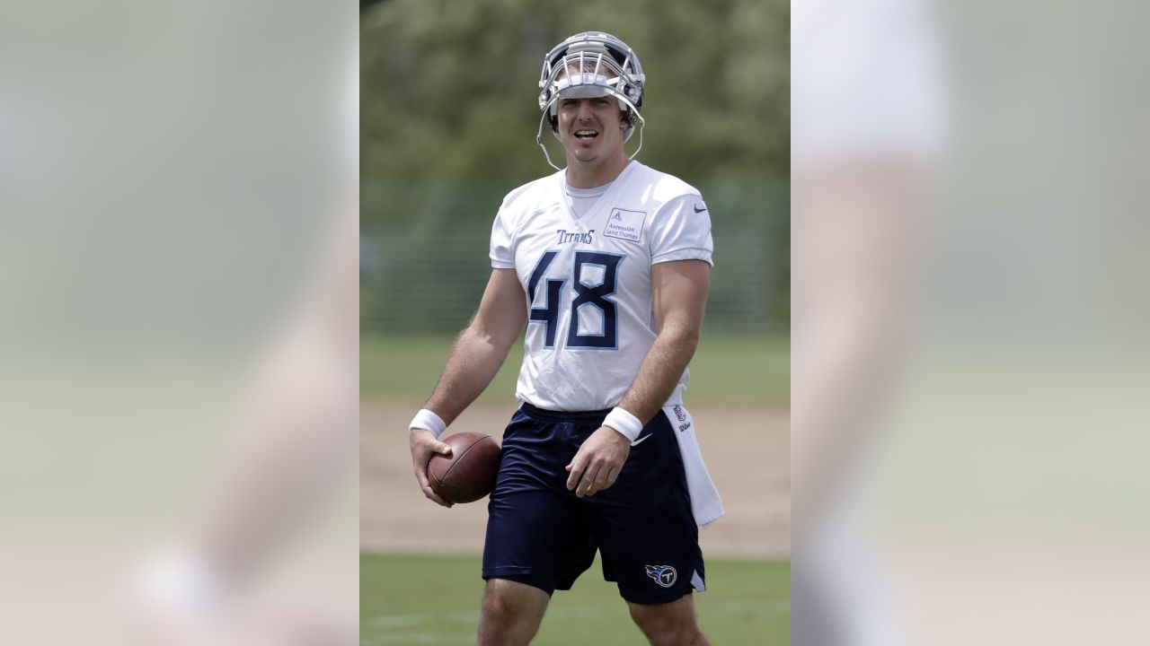 Tennessee Titans long snapper Beau Brinkley warms up before a