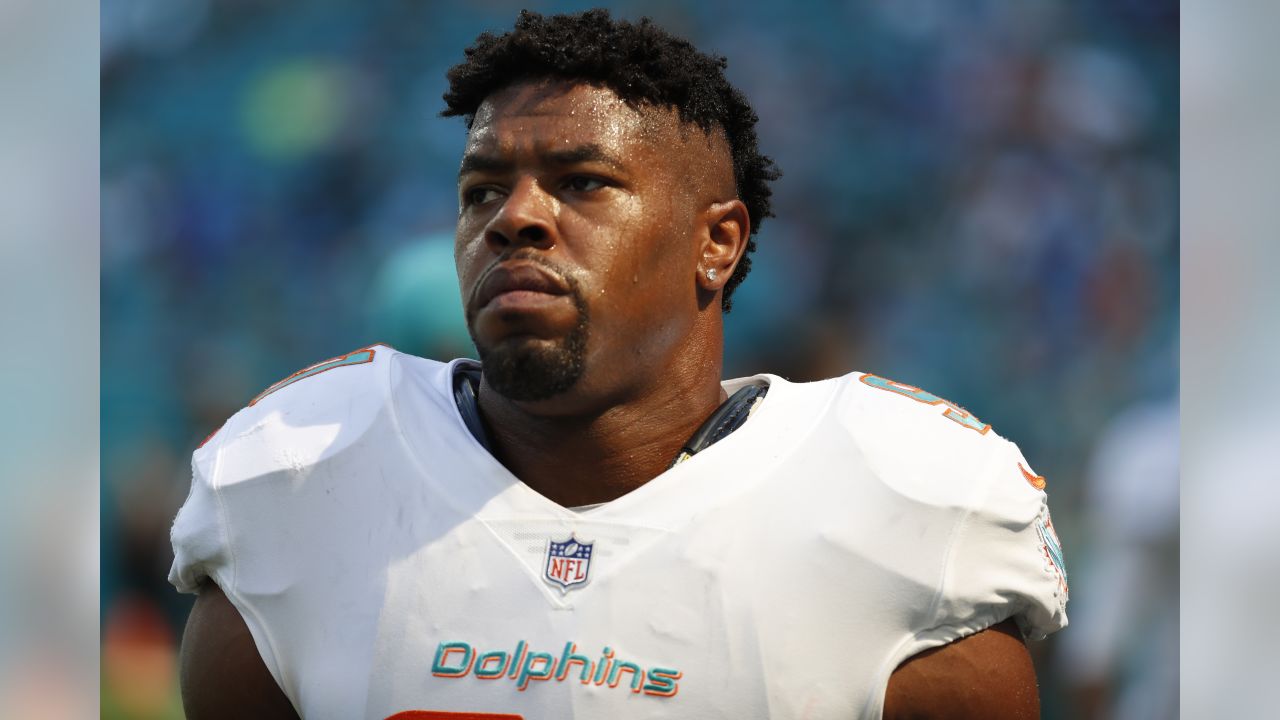 Miami Dolphins linebacker Raekwon McMillan (52) walks the sidelines, during  the second half of an NFL preseason football game against the Tampa Bay  Buccaneers, Thursday, Aug. 9, 2018, in Miami Gardens, Fla. (