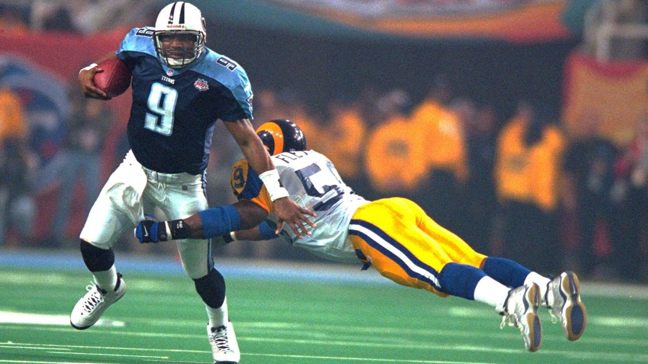 JANUARY 30 2000: Titans quarterback Steve McNair scrambles with the  football as the St. Louis Rams defeated the Tennessee Titans 23-17 to win  Super Bowl XXXIV at the Georgia Dome in Atlanta