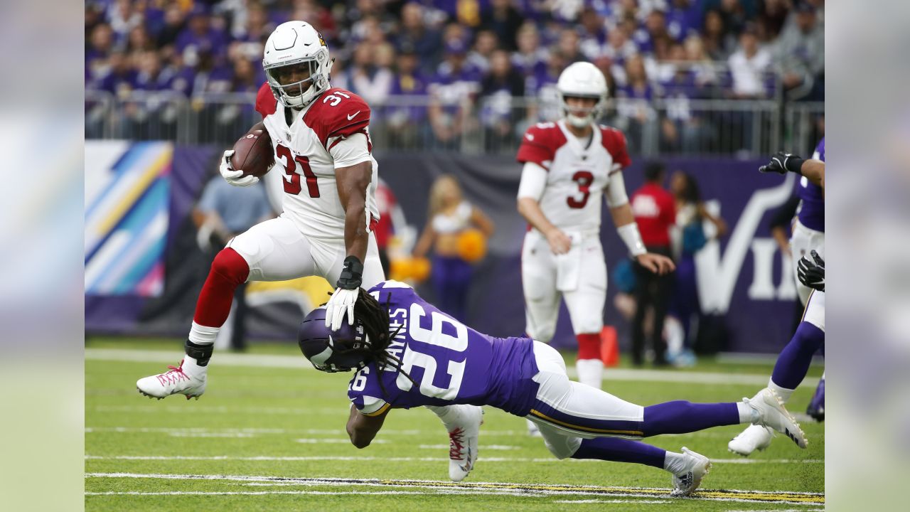 Arizona Cardinals running back David Johnson (31) breaks a tackle by Minnesota Vikings cornerback Trae Waynes (26) during the first half of an NFL football game, Sunday, Oct. 14, 2018, in Minneapolis.