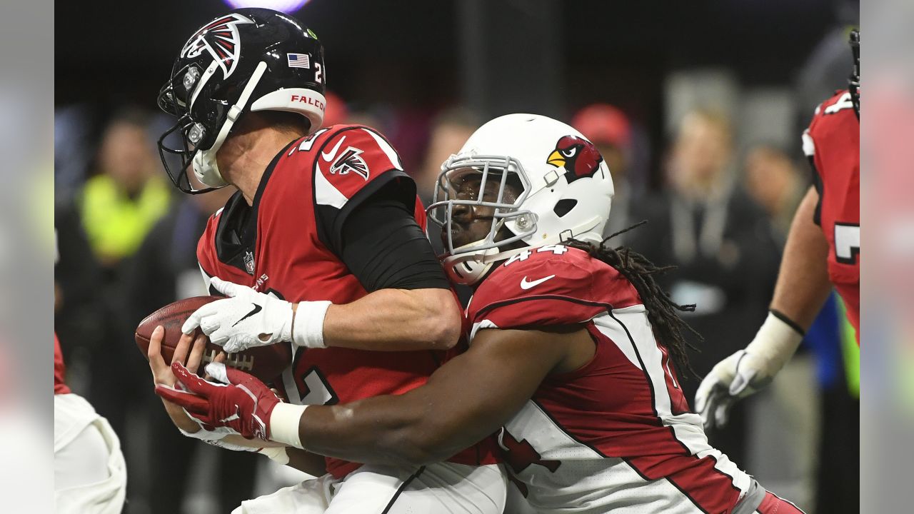 Arizona Cardinals defensive end Markus Golden (44) sacks Atlanta Falcons quarterback Matt Ryan (2) during the first half of an NFL football game, Sunday, Dec. 16, 2018, in Atlanta.
