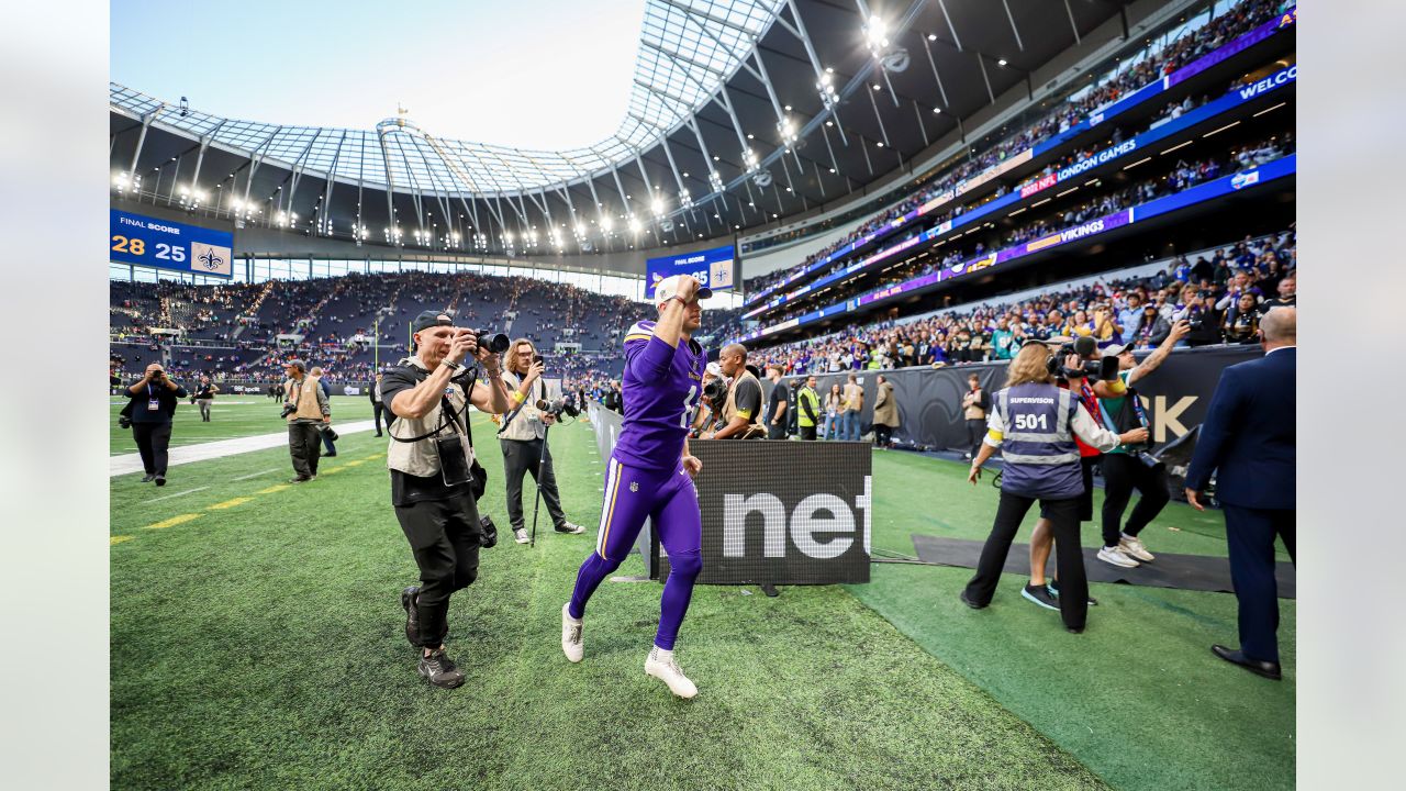 Minnesota Vikings fans hold up 'Defence' signs in support of their team  before the International Series NFL match at Twickenham, London Stock Photo  - Alamy