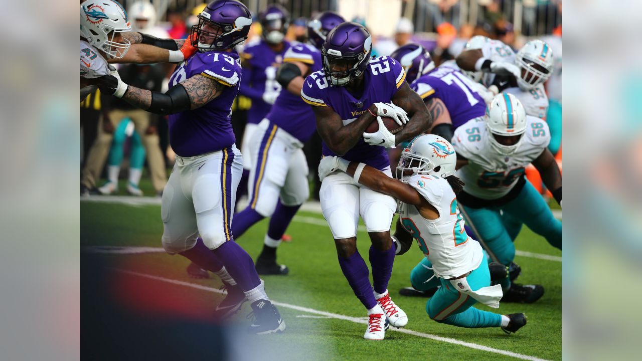 Miami Dolphins running back Kalen Ballage (27) runs the ball against the  Minnesota Vikings during an