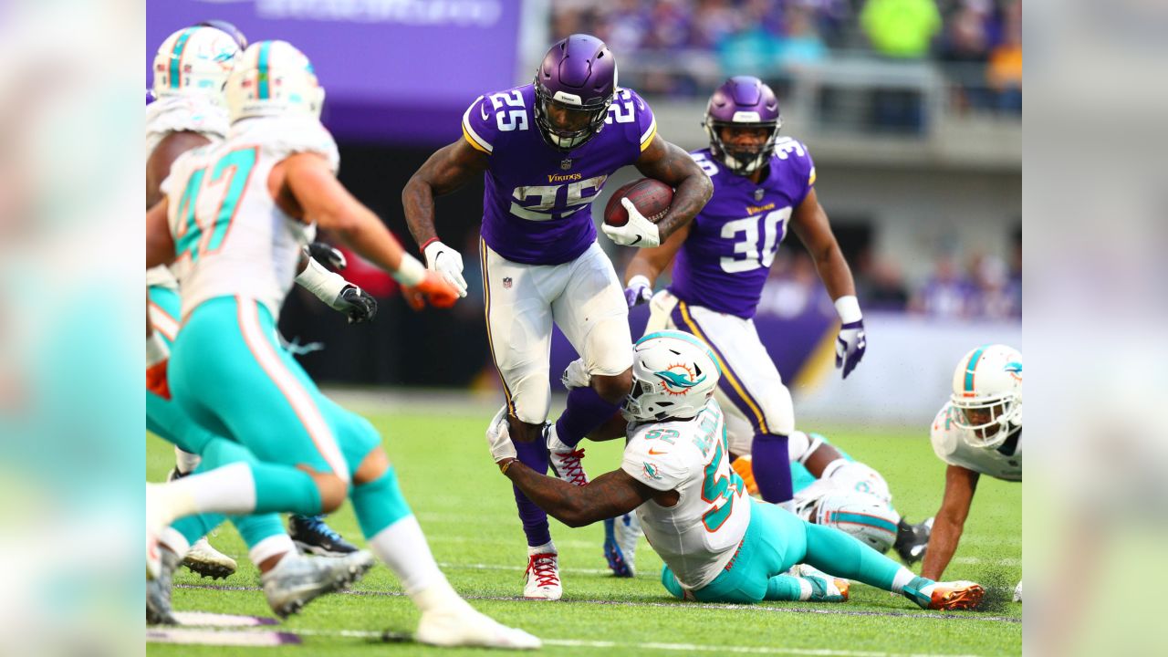 Miami Dolphins running back Kalen Ballage (27) runs the ball against the  Minnesota Vikings during an