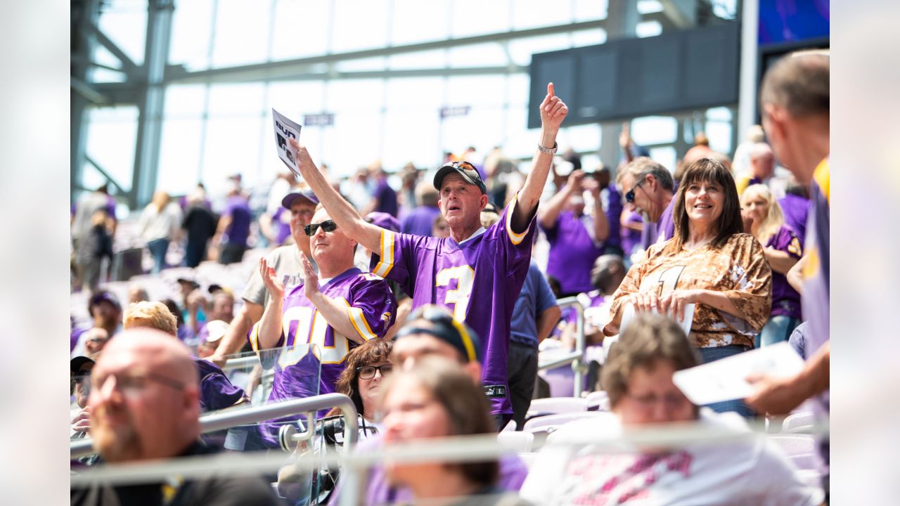 A Minnesota Vikings fan cheers during the opening ceremonies of an