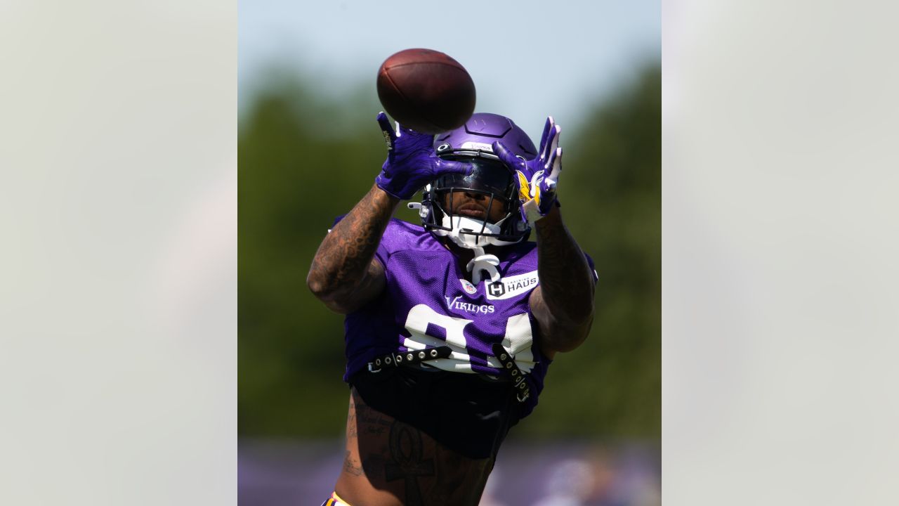 EAGAN, MN - AUGUST 02: Minnesota Vikings running back Dalvin Cook (33) runs  with the ball after a catch during training camp at Twin Cities Orthopedics  Performance Center in Eagan, MN on