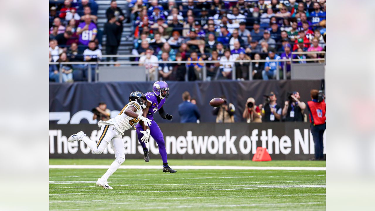 Minnesota Vikings fans hold up 'Defence' signs in support of their team  before the International Series NFL match at Twickenham, London Stock Photo  - Alamy