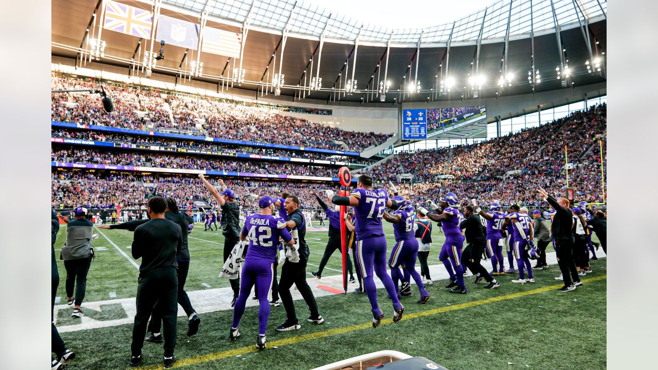 Minnesota Vikings fans hold up 'Defence' signs in support of their team  before the International Series NFL match at Twickenham, London Stock Photo  - Alamy